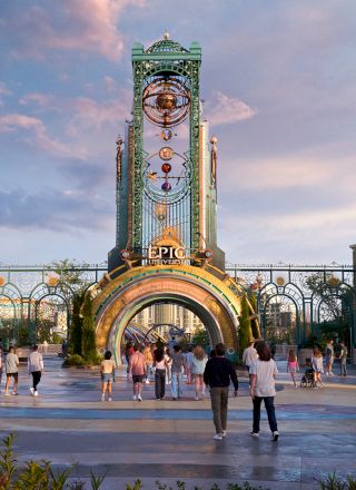 The image shows people walking through a vibrant, themed entrance with an arch and tower, under a colorful sky.